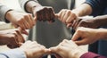 Diverse group of hands clasped together in a circle symbolizing unity and collaborative effort Royalty Free Stock Photo