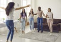 Diverse group of happy excited young women congratulating their friend on her success Royalty Free Stock Photo