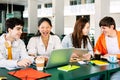 Diverse group of happy high school students studying together on campus Royalty Free Stock Photo