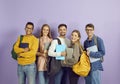 Diverse group of happy university or college students with backpacks, laptops and books Royalty Free Stock Photo