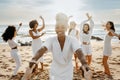 Diverse group of happy young female friends having fun outdoors on the beach, women celebrating hen party Royalty Free Stock Photo
