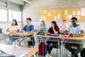 Diverse group of high school students listening teacher in classroom Royalty Free Stock Photo