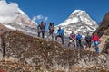 Diverse Group of Hikers staying on Rock in Himalaya Mountains