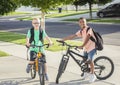 Diverse group of kids riding their bikes to school together Royalty Free Stock Photo