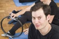 Diverse group of people in a gym class lying in a receding row o Royalty Free Stock Photo