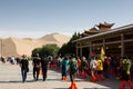 Diverse group of people heading to the Singing dunes and the Crescent Lake in the Kumtag Desert