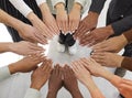 Diverse group of people joining hands to show concept of community, teamwork and support Royalty Free Stock Photo