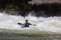 Diverse group of people rafting together in a flowing river