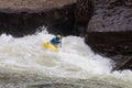 Diverse group of people rafting together in a flowing river