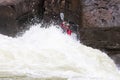 Diverse group of people rafting together in a flowing river