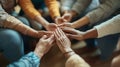 diverse group of people sitting in a circle with their hands gently Royalty Free Stock Photo