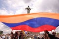 Group of people gathered around the Mother Armenia monument during a parade