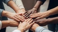 Diverse group of people with their hands stacked together in a circle of unity. Royalty Free Stock Photo
