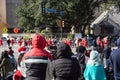 Diverse group of people in warm clothes jackets and live stream vlogger watching, broadcasting, streaming live street performance