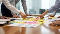Team Collaboration Brainstorming Session with Sticky Notes on Table Royalty Free Stock Photo