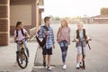 Group of school kids talking and walking home from school together Royalty Free Stock Photo