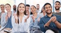 Diverse group of smiling businesspeople clapping in office training. Team of professional colleagues cheering and Royalty Free Stock Photo