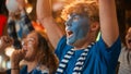 Diverse Group of Soccer Fans with Colored Faces Watching a Live Football Match in a Sports Bar Royalty Free Stock Photo