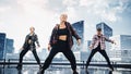 Diverse Group of Three Professional Dancers Performing a Hip Hop Dance Routine in Front of a Big D Royalty Free Stock Photo