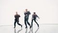 Diverse Group of Three Professional Dancers Performing a Hip Hop Dance Routine in Front of a Big D Royalty Free Stock Photo