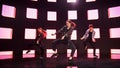 Diverse Group of Three Professional Dancers Performing a Hip Hop Dance Routine in Front of a Big L Royalty Free Stock Photo