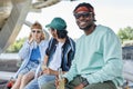 Smiling black man looking at camera with friends Royalty Free Stock Photo