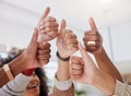 Diverse group of unknown ethnic business women showing thumbs up with hand gesture after meeting in office. Ambitious Royalty Free Stock Photo