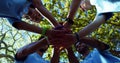 Diverse group of volunteers stack hands outdoors, with copy space Royalty Free Stock Photo