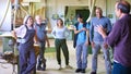 Diverse group of workers listening to a supervisor in workshop Royalty Free Stock Photo