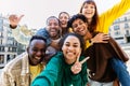 Diverse group of young students having fun taking selfie portrait together Royalty Free Stock Photo