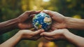 Diverse Hands Gently Holding Earth Globe Outdoors Royalty Free Stock Photo