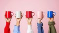 The colorful mugs held up.AI generated image Royalty Free Stock Photo
