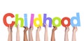 Diverse Hands Holding The Word Childhood Royalty Free Stock Photo