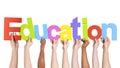 Diverse Hands Holding The Word Education Royalty Free Stock Photo