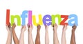 Diverse Hands Holding The Word Influenza Royalty Free Stock Photo