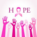 Diverse hands joining for breast cancer awareness