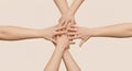 Diverse hands joining together in a collaborative circle, unity concept. Royalty Free Stock Photo