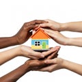 Diverse hands protecting and supporting a toy house Royalty Free Stock Photo