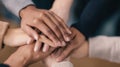 Diverse hands stacking together, symbolizing unity, teamwork, and strong support in a collaborative group Royalty Free Stock Photo
