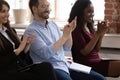 Diverse happy business team audience group applauding sit on chairs Royalty Free Stock Photo