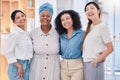 Diverse, happy and smiling portrait of a creative team of designers standing in a modern office. Young successful group