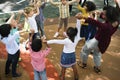 Diverse kindergarten kids arms raised