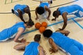 Diverse male basketball players doing push ups and warming up at gym Royalty Free Stock Photo