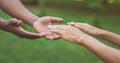 Diverse male and female hands stretch to each other