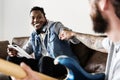 Diverse men dancing together listening to music Royalty Free Stock Photo