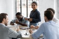 Diverse millennial business team with Indian leader discussing project Royalty Free Stock Photo