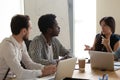 Multiethnic diverse employees brainstorm at meeting in office Royalty Free Stock Photo