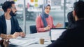 Diverse Modern Office: Successful Young Muslim Businesswoman Wearing Hijab Leads Meeting Discussio