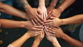 Diverse multi-ethnic men, women stack hands in circle. Action represents strong teamwork, unity, collaboration, friendship. Royalty Free Stock Photo