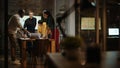 Diverse Multiethnic Team are Having a Conversation in a Meeting Room Behind Glass Walls in a Creat Royalty Free Stock Photo